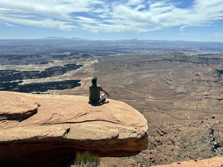 Adult Male Sitting on the Edge Of a Stunning Viewpoint by Ryan Rossotto/Stocktrek Images art print