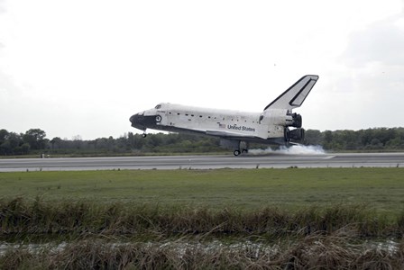 Space Shuttle Discovery Touches Down on the Runway at Kennedy Space Center by Stocktrek Images art print