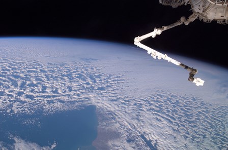 The Robotic Canadarm2 above Earth by Stocktrek Images art print